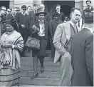  ??  ?? Albertina Sisulu, left, and Winnie Mandela leave the Palace of Justice during the Rivonia Trial in this shot by Alf Kumalo.
