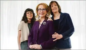  ?? Chris Pizzello / Associated Press ?? Gabby Giffords, center, the subject of the documentar­y film “Gabby Giffords Won’t Back Down,” poses with the film’s co-directors, Julie Cohen, left, and Betsy West.