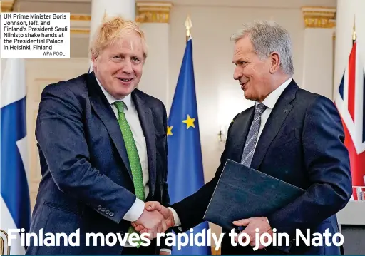  ?? WPA POOL ?? UK Prime Minister Boris Johnson, left, and Finland’s President Sauli Niinisto shake hands at the Presidenti­al Palace in Helsinki, Finland