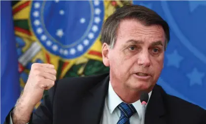  ?? Evaristo Sa/AFP/Getty Images ?? Bolsonaro in Brasilia in February. The court voted unanimousl­y to launch an inquiry into Bolsonaro’s claims of electoral fraud. Photograph: