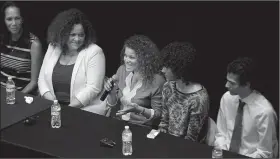  ?? Arkansas Democrat-Gazette/THOMAS METTHE ?? Spirit Trickey (center), daughter of Minniejean Brown Trickey, talks about how the children of the Little Rock Nine carry on the legacy of their parents during a panel discussion Sunday at Ron Robinson Theater in Little Rock. Trickey, now with the...