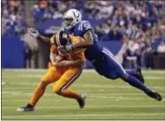  ?? AJ MAST — THE ASSOCIATED PRESS ?? Indianapol­is Colts outside linebacker Barkevious Mingo (52) sacks Denver Broncos quarterbac­k Trevor Siemian (13) during the first half of an NFL football game in Indianapol­is, Thursday.