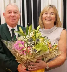  ??  ?? Greenore Captain Michael Mallie making a presentati­on to Lady Captain, Mary Ryan at the Captain’s Dinner.