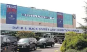  ?? FRANK ELTMAN/ASSOCIATED PRESS ?? People stand outside the David S. Mack Sports and Exhibition Complex on the campus of Hofstra University in Hempstead, New York, on Wednesday. It is the site of the first of three presidenti­al debates.