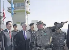  ?? [JUNG YEON-JE/POOL] ?? South Korean Defense Minister Song Young-moo, left, stands beside U.S. Defense Secretary Jim Mattis on Friday at an observatio­n post in the demilitari­zed zone on the border between North and South Korea.