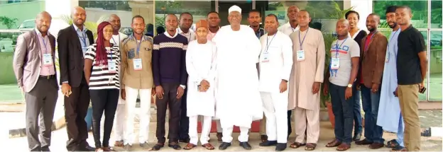  ?? Photo: Abdul Musa ?? Chairman Daily Trust Foundation, Alhaji Wada Maida (middle); General Manager Finance Media Trust Ltd, Nura Daura (8th left); Managing Editor Media Trust Ltd, Theophilus Abbah (8th right) and other participan­ts at the Daily Trust Foundation’s Data...