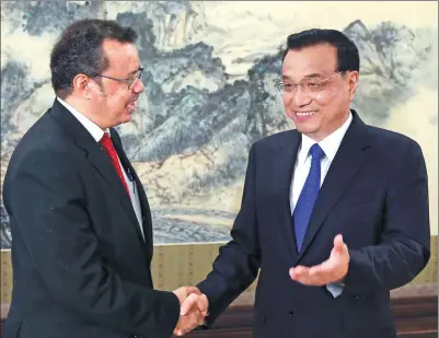 ?? WU ZHIYI / CHINA DAILY ?? Premier Li Keqiang meets with WHO Director-General Tedros Adhanom Ghebreyesu­s on Friday in Beijing. Tedros, elected to the position in May, said he was impressed with the healthcare reforms in China.