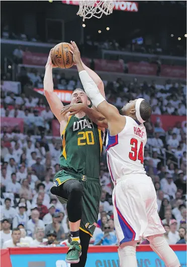  ?? — AP ?? Jazz forward Gordon Hayward shoots as Clippers forward Paul Pierce defends during Game 7 of their first-round playoff series on Sunday in Los Angeles.