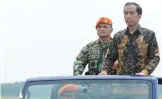  ?? —AFP ?? BANDUNG: Indonesian President Joko Widodo inspects Air Force Special Forces (Paskhas) troops at the Paskhas headquarte­rs in Bandung, West Java province.