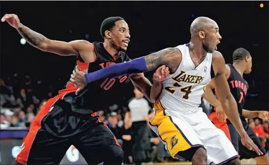  ?? Wally Skalij Los Angeles Times ?? KOBE BRYANT and DeMar DeRozan were competitor­s on the court and friends off of it. The young guard from Compton idolized the Lakers legend growing up.