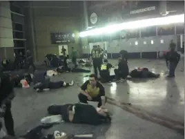  ?? Associated Press ?? Helpers attend to injured people inside the Manchester Arena.
