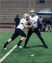  ?? TIM GODBEE / For the Calhoun Times ?? Calhoun’s Gavin Gray (right) hands off to Zack Fuller during last Friday’s game vs. Cedar Grove.