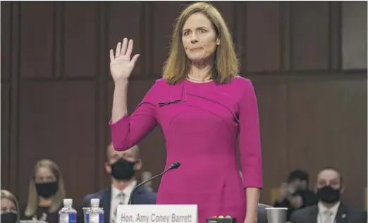 ?? PATRICK SEMANSKY, POOL/AP ?? Supreme Court nominee Amy Coney Barrett is sworn in during her confirmati­on hearing on Monday in Washington.