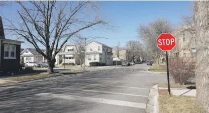  ?? ANTHONY VAZQUEZ/ SUN-TIMES (ABOVE); PROVIDED (RIGHT) ?? ABOVE: The intersecti­on of West Grace Street and North Long Avenue in Portage Park on Monday. A bicyclist was struck by a vehicle on the stretch of road last week. RIGHT: Police issued this photo of a black two-door Jeep Wrangler sought in connection with the crash Friday.