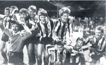  ??  ?? Chorley celebrate knocking Wolves out of the cup on a windswept November night at Burnden Park