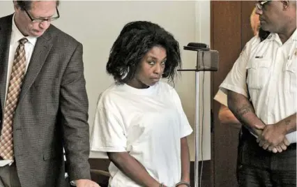  ?? TED FITZGERALD/POOL ?? Audrea Gause, 26, of Troy, N.Y., at her arraignmen­t Friday on a larceny charge. At left is public defender John Hayes.