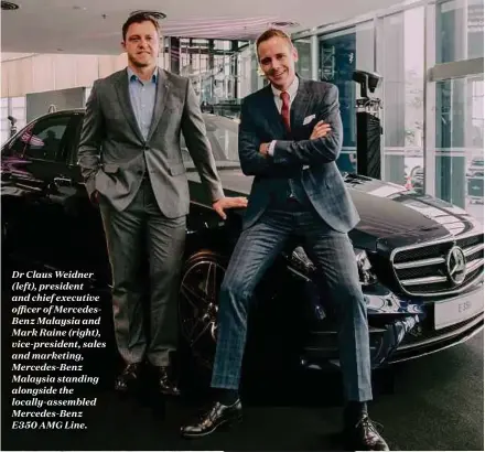  ?? 19A2M7 FoLridne. ?? Dr Claus Weidner (left), president and chief executive officer of MercedesBe­nz Malaysia and Mark Raine (right), vice-president, sales and marketing, Mercedes-Benz Malaysia standing alongside the locally-assembled Mercedes-BenzE35A 0 G