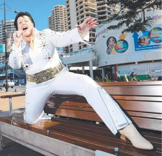  ?? Picture: RICHARD GOSLING ?? Australia's only full-time female Elvis tribute artist Sheryl Scharckie gets in the groove at Surfers Paradise.