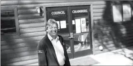  ?? ASSOCIATED PRESS ?? TUSAYAN MAYOR CRAIG SANDERSON STANDS outside the town’s office on Wednesday, Nov. 1, in Tusayan, Ariz. Residents voted down a ballot measure to increase building heights in the small town outside the Grand Canyon’s South Rim entrance.