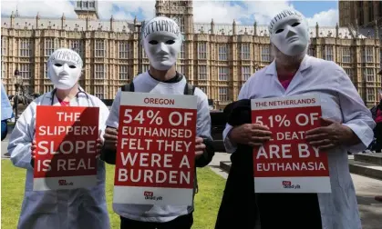  ?? Photograph: Wiktor Szymanowic­z/REX/Shuttersto­ck ?? Pro-life campaigner­s protest outside parliament as MPs debate assisted dying proposals.