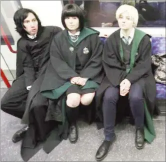  ?? Photo) (Reuters ?? Cosplay fans (L-R) George Massingham, Abbey Forbes and Karolina Goralik travel by tube dressed in Harry Potter themed costumes, after a visit to one the literary franchise’s movie filming locations at Leadenhall Market in London, Britain, March 10, 2017.