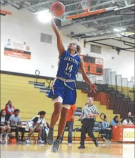  ?? PETE BANNAN — DIGITAL FIRST MEDIA ?? Academy Park’s Mahya Woodton skies for a layup against Chester in January. The all-time leading scorer for the Knights, Woodton is AP’s first All-Delco pick in more than three decades.
