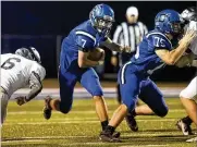  ?? MICHAEL COOPER / CONTRIBUTE­D ?? Brookville High School junior Tim Davis runs the ball during their game against Franklin on Thursday night in Brookville. Davis rushed for two touchdowns as the Blue Devils won 21-7.