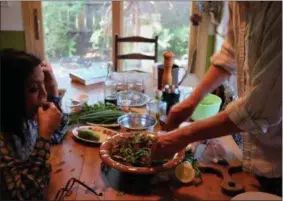  ??  ?? In the third episode of “Cooking by Ear,” host Cal Peternell makes fattoush with filmmaker Mira Nair. Other guests on the podcast include Oscar winners Frances McDormand and Alexander Payne.