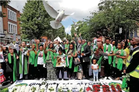 ?? — Reuters ?? Doves are released during commemorat­ions to mark the first anniversar­y of the Grenfell Tower fire, near the burnt out social housing apartment block in west London, on Thursday.