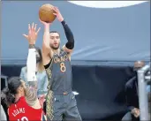  ?? ARMANDO L. SANCHEZ/CHICAGO TRIBUNE ?? Bulls guard Zach LaVine shoots over Pelicans center Steven Adams during the first half Wednesday at the United Center.