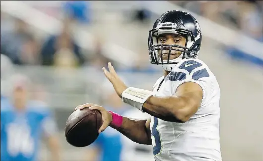  ?? — GETTY IMAGES ?? Russell Wilson of the Seattle Seahawks sets to pass in last weekend’s 28-24 loss to Detroit. He has been given more freedom in play calls by head coach Pete Carroll.