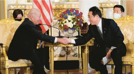  ?? EVAN VUCCI/AP ?? Japanese Prime Minister Fumio Kishida, right, hosts President Joe Biden on Monday at Akasaka Palace in Tokyo.