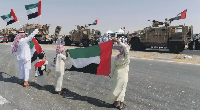  ??  ?? Emiratis celebrate the first return of UAE soldiers from Operation Restoring Hope in Yemen, at the entrance to Zayed Military City, Abu Dhabi, in November 2015 Antonie Robertson / The National