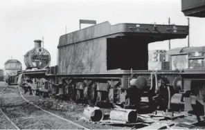  ?? J Randford Collection/Kiddermins­ter Railway Museum ?? Above: The career of No 6868 Penrhos Grange spanned the period March 1939 through to 26 October 1965, when withdrawn from
Oxford shed, its home since November 1963, and put into store. Sold as scrap, No 6868 and its 4,000 gallon tender were taken apart at Banbury shed, a one-off, and the process proved rather drawn out, with partial cutting witnessed on 22 January, while this view was recorded nearly two months later, on 20 March 1966, and there was still something to be seen towards the end of April! The scrap merchant was J Friswell of Banbury and some parts did survive. Remarkably, two are in the mix for a new life in steam – the safety valve cover has found a home with No 1014 County of Glamorgan, while the chimney, seen defiantly tall mid-scrapping, now adorns No 6880 Betton Grange.