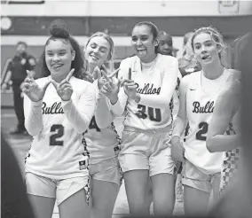  ?? SAUL YOUNG/NEWS SENTINEL ?? Bearden players celebrate their win over Farragut in the Region 2-4A semifinal on Feb. 27.