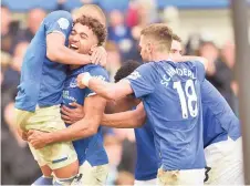  ??  ?? Everton’s English striker Dominic Calvert-Lewin (second le ) celebrates with Everton’s Brazilian striker Richarliso­n (le ) and teammates a er scoring their third goal during the English Premier League football match between Everton and Crystal Palace at Goodison Park in Liverpool, north west England.