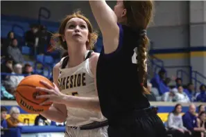  ?? The Sentinel-Record/Krishnan Collins ?? Lakeside’s Allie Pollock drives into the paint against Mount St. Mary’s Millie Allgood at Lakeside Athletic Complex Wednesday.