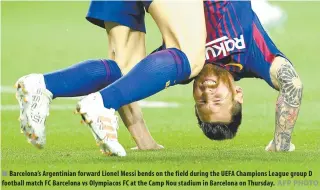  ?? AFP PHOTO ?? Barcelona’s Argentinia­n forward Lionel Messi bends on the field during the UEFA Champions League group D football match FC Barcelona vs Olympiacos FC at the Camp Nou stadium in Barcelona on Thursday.