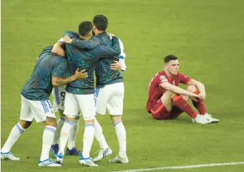  ?? CHRISTOPHE ENA/AP ?? Real Madrid players celebrate their victory at the end of the Champions League final soccer match between Liverpool and Real Madrid at the Stade de France in Saint Denis near Paris on Saturday.