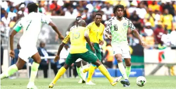  ??  ?? Nigeria’s Alexander Iwobi makes a pass during the African Cup of Nations qualifier match between South Africa and Nigeri at Soccer City Stadium in Johannesbu­rg, South Africa. — AFP photo