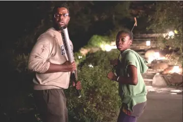  ??  ?? Gabe Wilson (Duke) and Zora Wilson (Shahadi Wright Joseph) in ‘Us’. — Universal Pictures