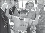 ?? AP PHOTO/FILE ?? In this April 21, 1980 file photo, Rosie Ruiz waves to the crowd after after being announced as winner of the women’s division of the Boston Marathon in Boston. Her title was stripped eight days later.