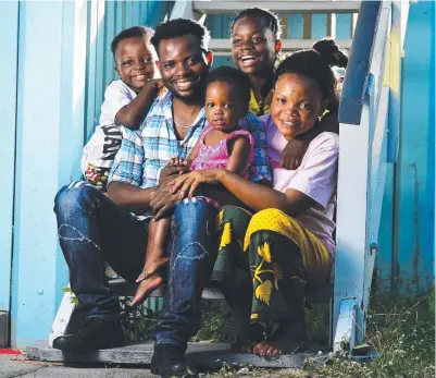  ?? HAPPY FAMILY: Refugee family from Congo, Uweza Saleh Bejo and partner Josephine Ramy Myrene, with children Adolphine J- Shasha Uweza, 1, Jeab Bonfils Uwezo, 5 and Johari Uwezo, 10. Picture: ZAK SIMMONDS ??