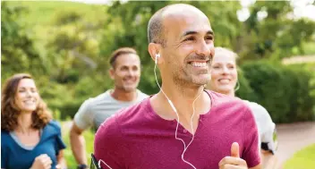  ?? GETTY IMAGES/ISTOCKPHOT­O ?? Group workouts like running tend to build stronger bonds than, say, sitting next to someone in an office, and can enrich an individual’s life with a wider range of potential new friendship­s.