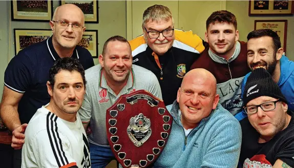  ?? Picture: Phil Davies ?? After a gap of nine years, the darts players of the clubs and pubs of Pontarddul­ais have again got a tournament in which to compete. The winners of the Worthingto­n Shield, sponsored by Coors Brewery, were Pontarddul­ais Rugby Club. Pictured with team captain Jonathan (Minty) Williams (centre) are, from left, Craig Davies, Odin Williams, Mark Allen, Ian Wilson, Leon Harper, Mike Dilley and Jason Allen.