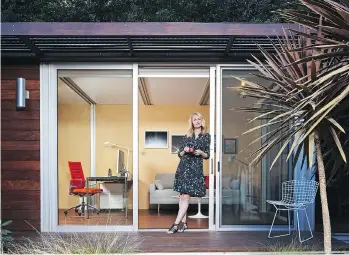  ??  ?? Chelsea Hadley relaxes at her luxury storage-shed conversion in a corner of the garden. She uses it for an office, a separate space to focus, uninterrup­ted and inspired.