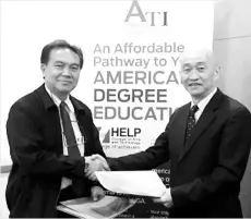  ??  ?? Henry Lim and Defiry Ubin exchanging the Memorandum of Agreement.