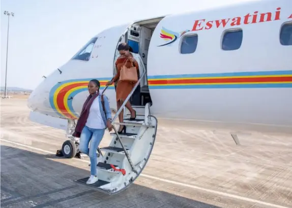  ?? ?? ▲Passengers disembark from an Eswatini Air jet.