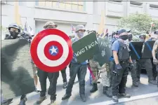  ?? BROOKE HERBERT — THE OREGONIAN VIA AP) — THE OREGONIAN VIA AP) — THE OREGONIAN VIA AP) — THE OREGONIAN VIA AP ?? Opposing rallies battle with mace, paint balls and rocks near Justice Center in downtown Portland Saturday, August 22, 2020. Dueling demonstrat­ions in Portland by right-wing and left-wing protesters have turned violent near a county building that’s been the site of numerous recent protests.