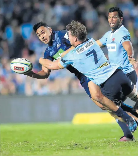  ??  ?? Stephen Perofeta and the Blues produced an impressive display to upset the Waratahs in Sydney on Saturday.